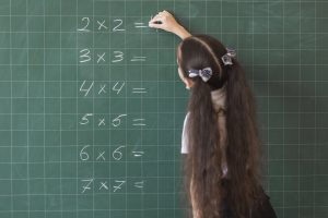 Pricing for The Tutor Team - Experience Online Tutors - Girl answering equations